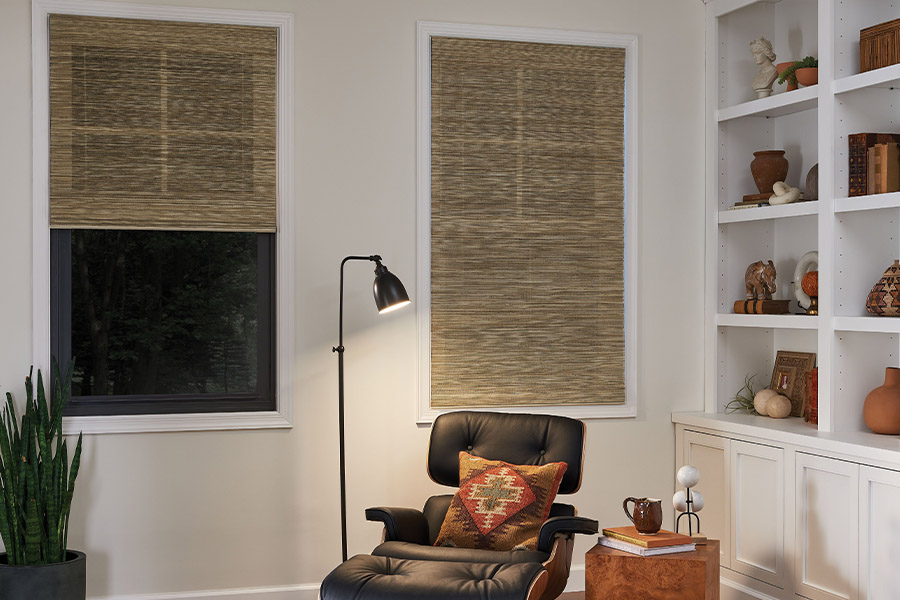 Tan woven fiber shades on den windows